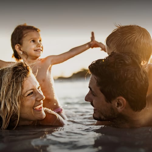Family playing in the water